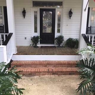 Finished post and rails on front porch